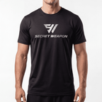 Person wearing a black t-shirt with 'Secret Weapon' logo on a white background